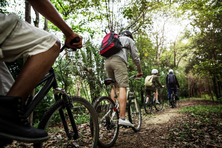 group-friends-ride-mountain-bike-forest-together